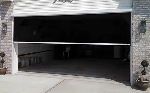 House with a half opened garage screen