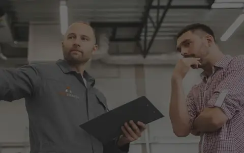 Action Overhead Garage Door technician talking to a customer