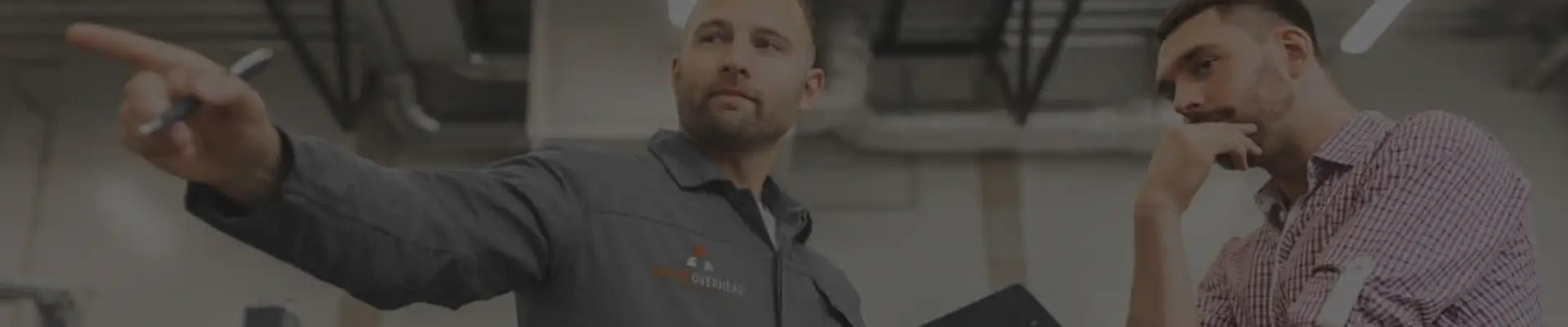 Action Overhead Garage Door technician talking to a customer