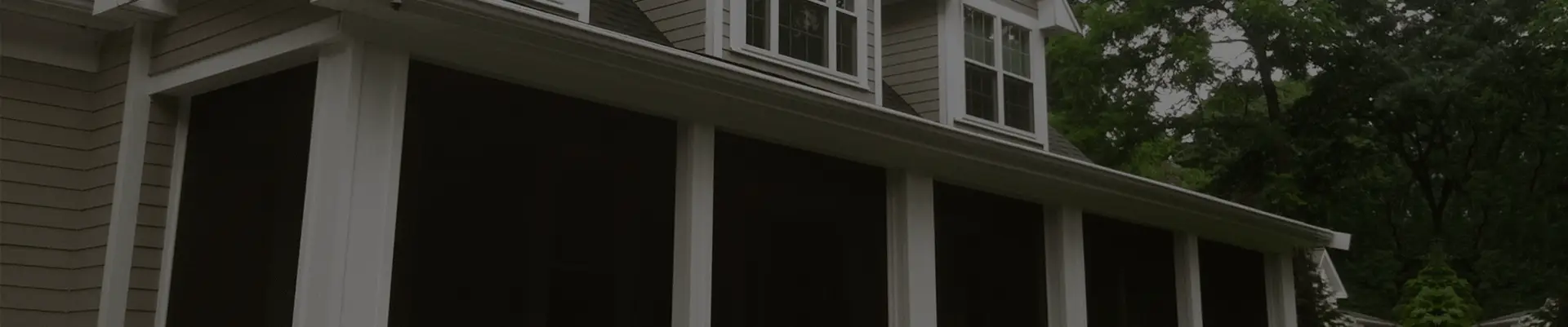 Residential garage door with Zip Tex Roll-up solar shades