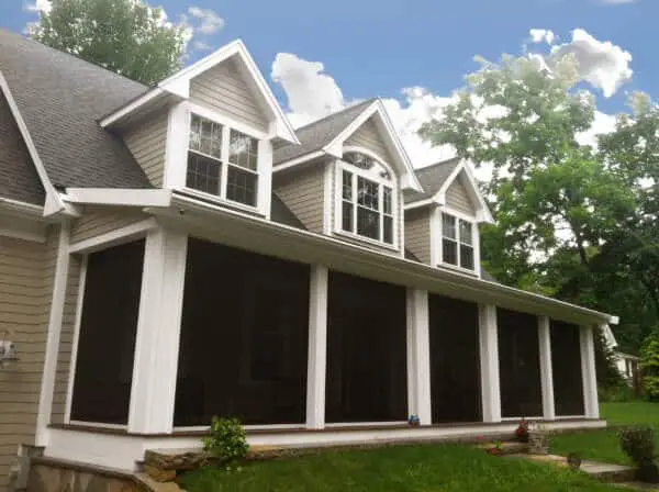 Residential garage door with Zip Tex Roll-up solar shades